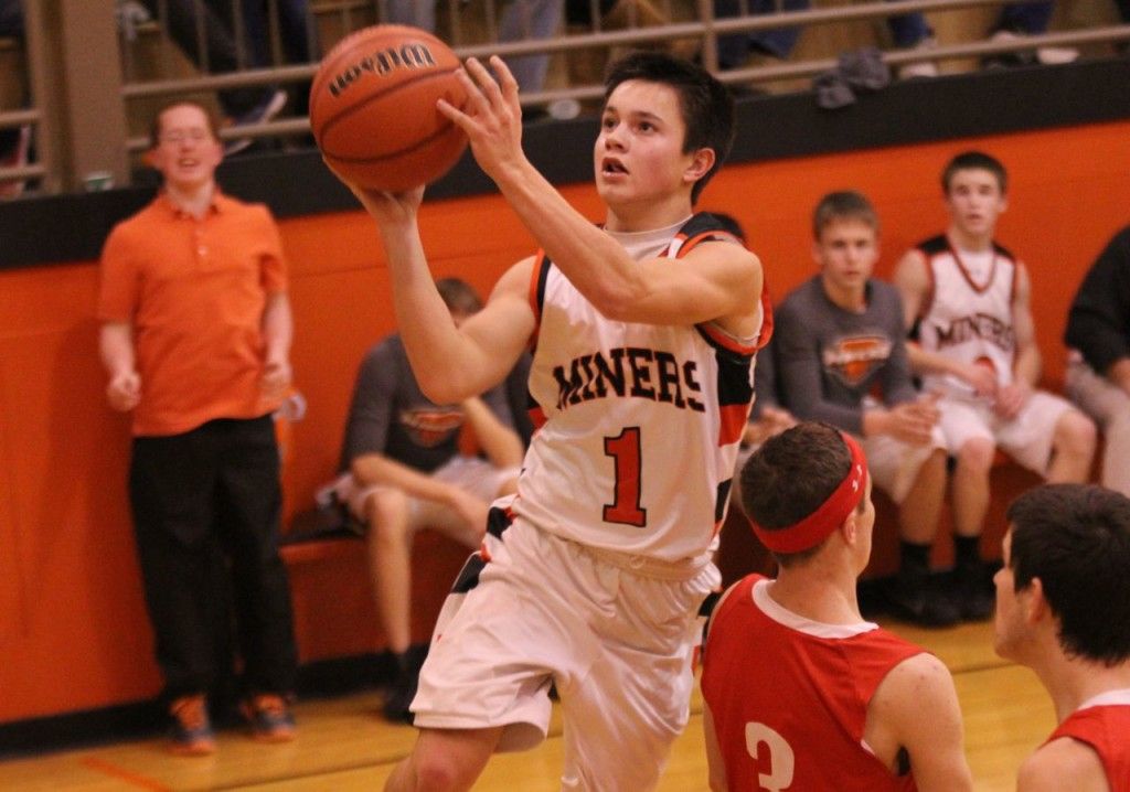 Tate Wargo flies through the air and lays the ball in for a bucket.