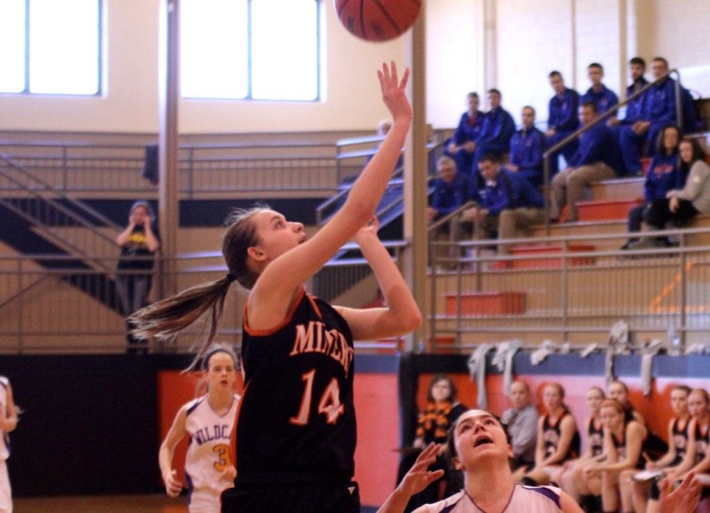 Abbie Barber leads the Lady Miners on a break away and shoots a layup. 