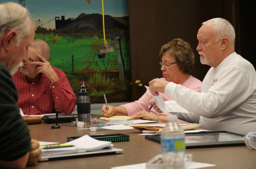 Dave Tucker reads the city's demolition ad. 