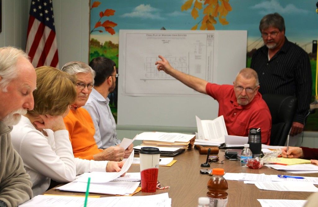 Mayor John Hicks directs the council's attention to the final plot of the Western View Estates. 