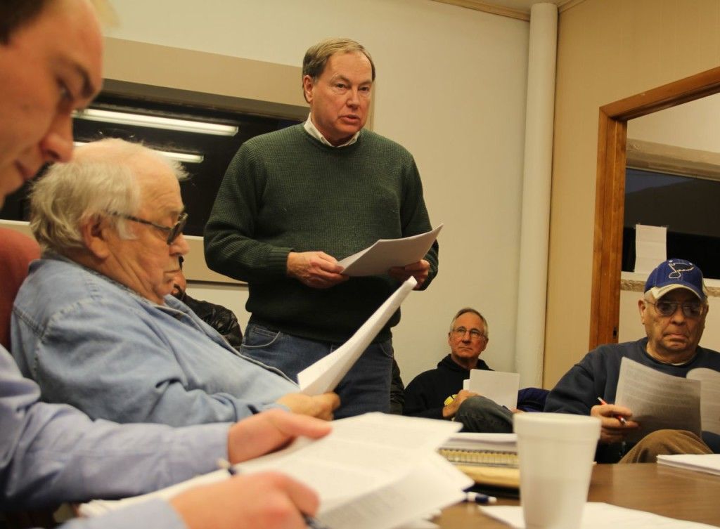 Jim Schrempf (green) provides remarks to the Benld City Council. Pictured (L-R) Peyton Bernot, Jim Kelly and Mickey Robinson, right