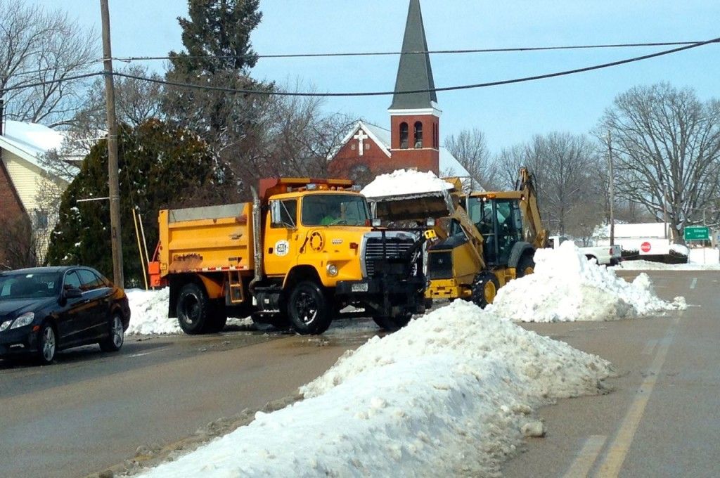 The City of Gillespie street department clears the snow from the middle of Macoupin Street during the day on Saturday. 