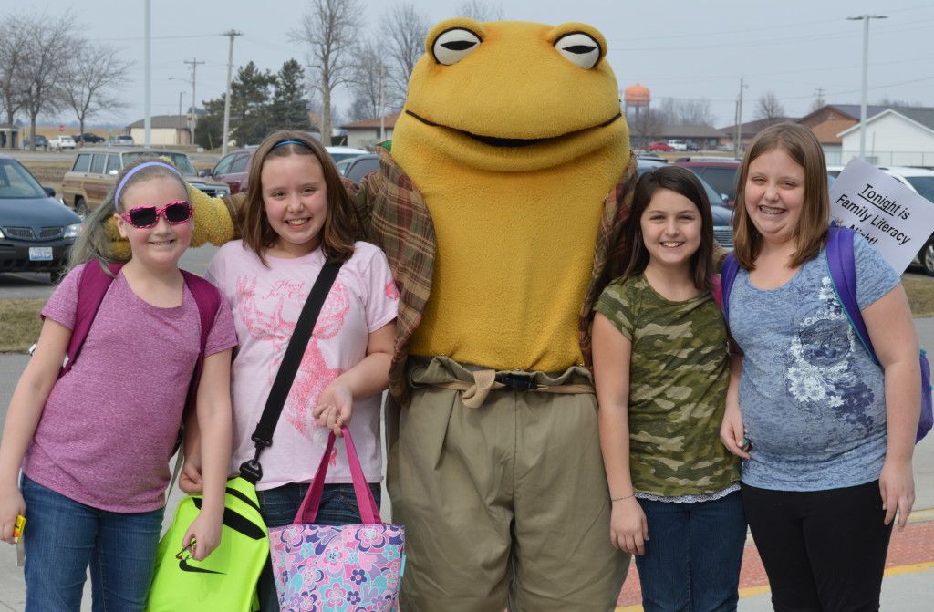 Students pose with storybook character Toad. 