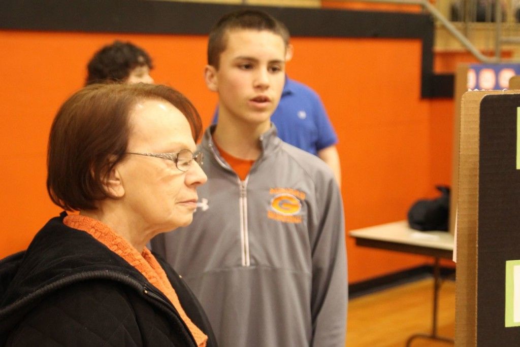 Students present their science fair project to the public Wednesday evening. 