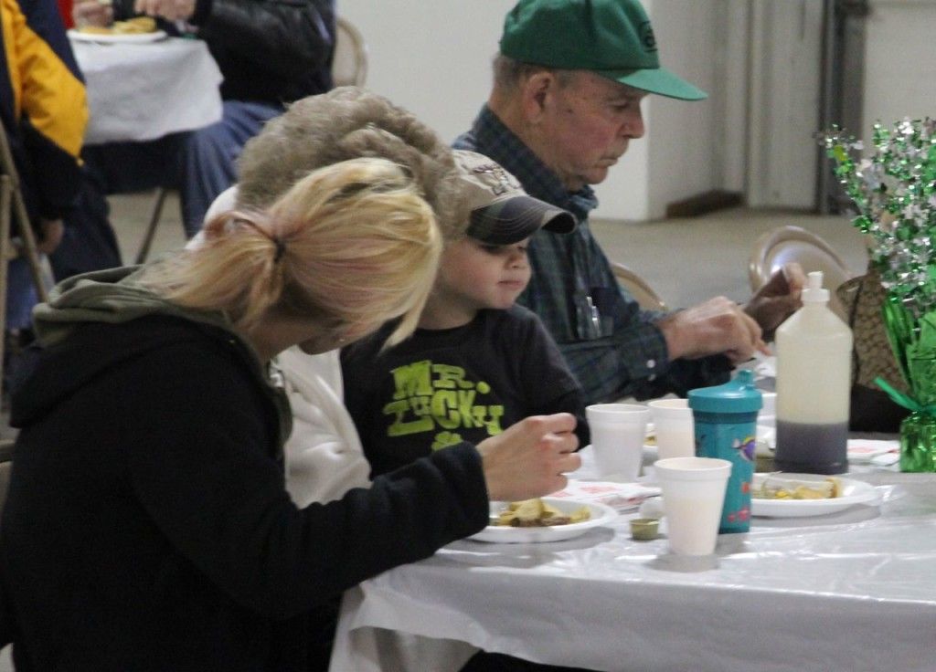 People of all ages enjoy the breakfast.