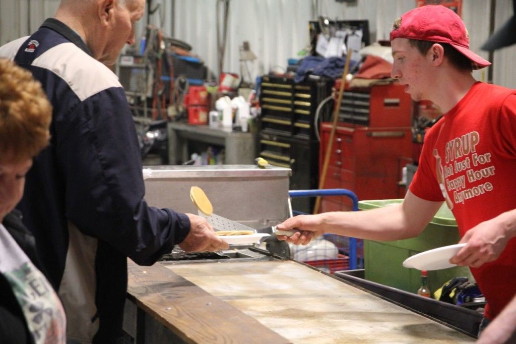 Chris Cakes hands over a flapjack to a customer. 