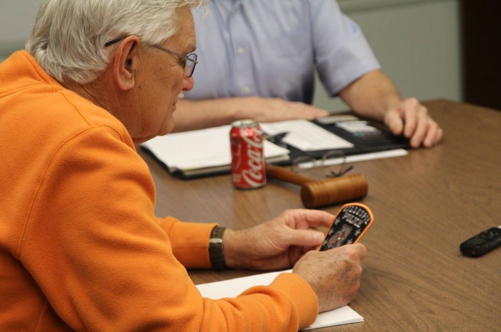 Alderman Jim Alderson reviews the new police patch for the Gillespie Police Department. 