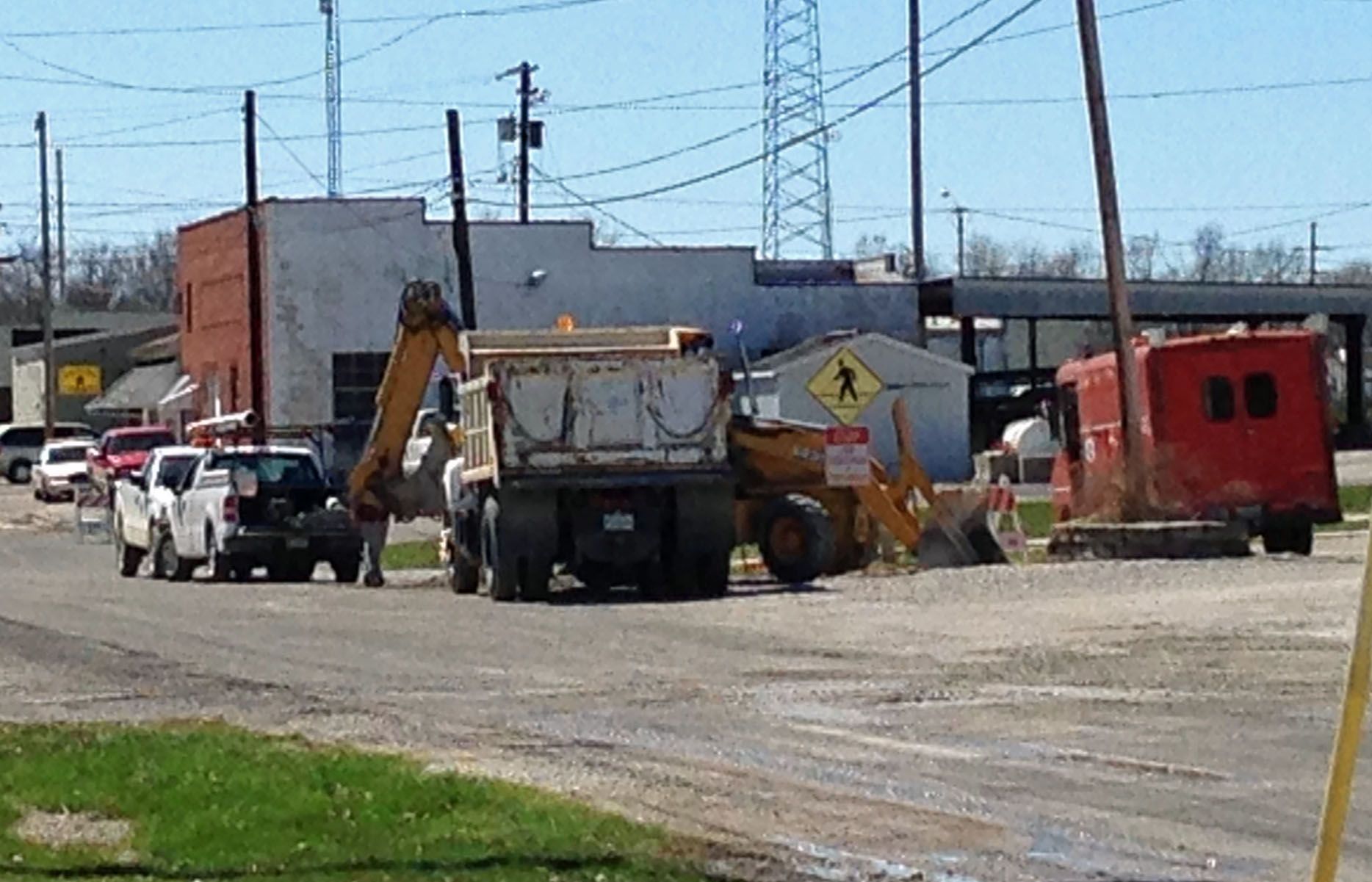 Workers with the City of Gillespie work on Walnut Street Tuesday. 