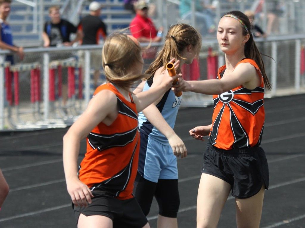 Sam Alepra passes the baton off to Amanda Schmidt. (Archived photo)