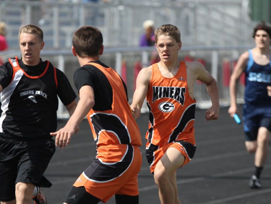 Austin Cooper passing the baton off to Zach Carr.
