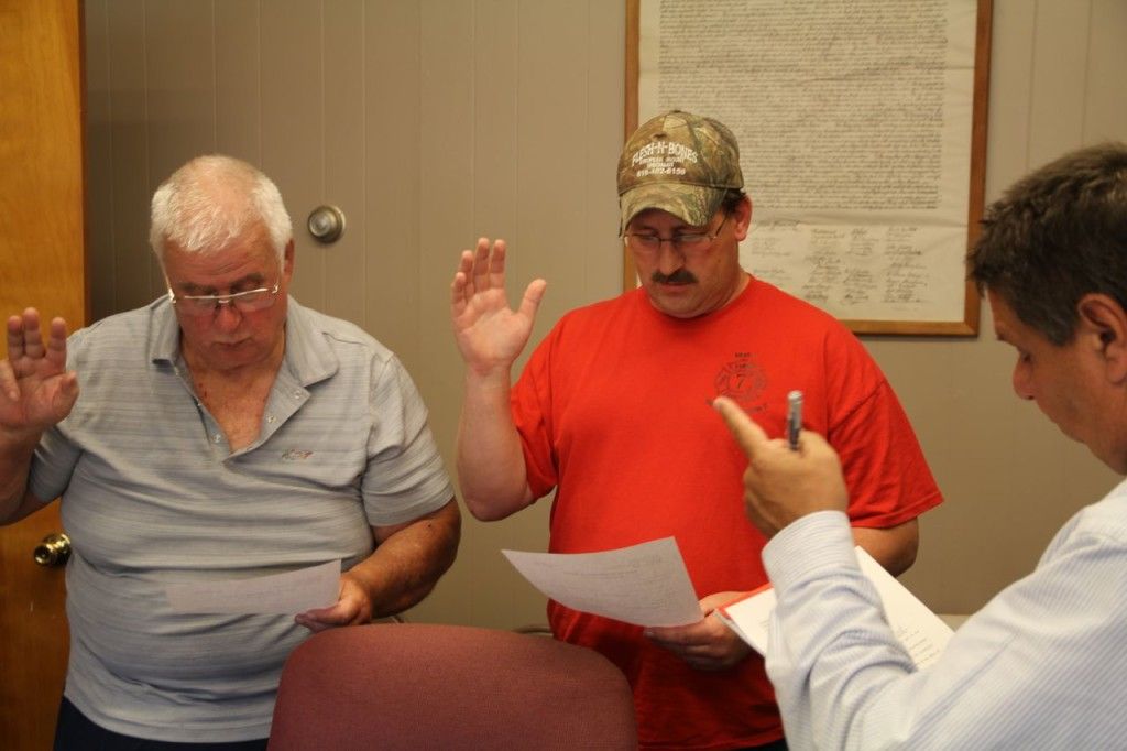 City attorney Rick Verticchio swears in Benld alderman Jim Tilishalski and Brian Frensko to the council. 