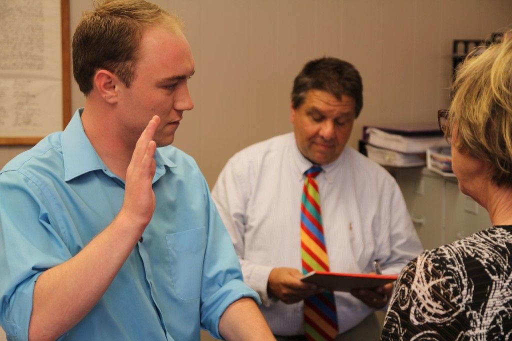 Alderman Peyton Bernot is sworn into the Benld council by City Attorney Rick Verticchio. 