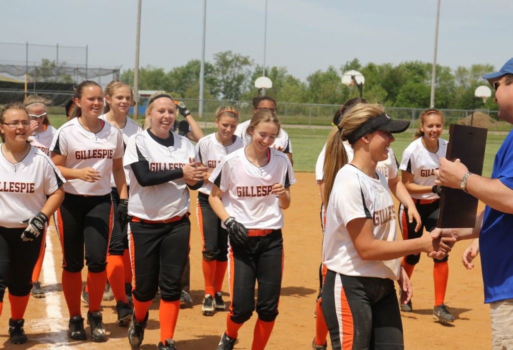 The Gillespie softball team accepts their championship plaque yesterday after defeating North Mac 4-3.