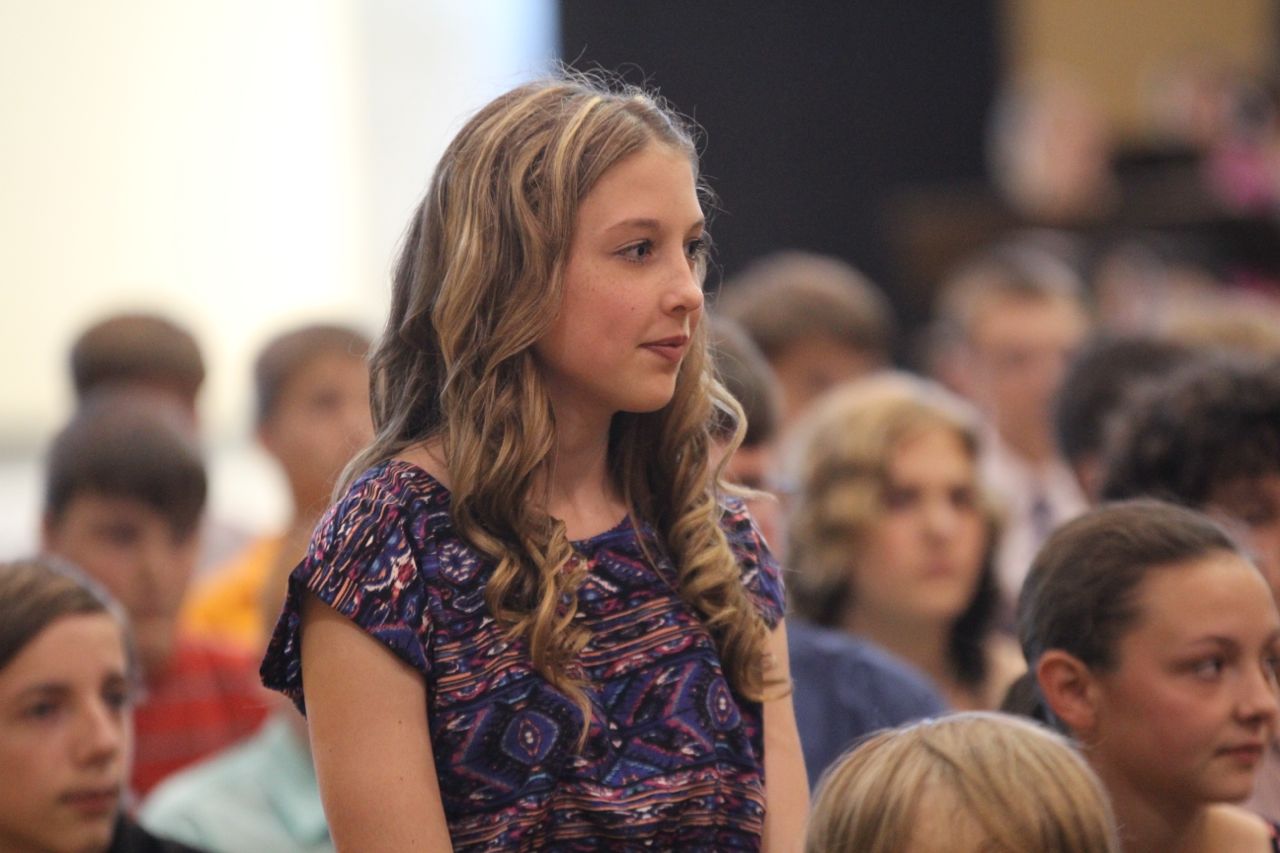 Madison Hedrick stands after being recognized for an award. 