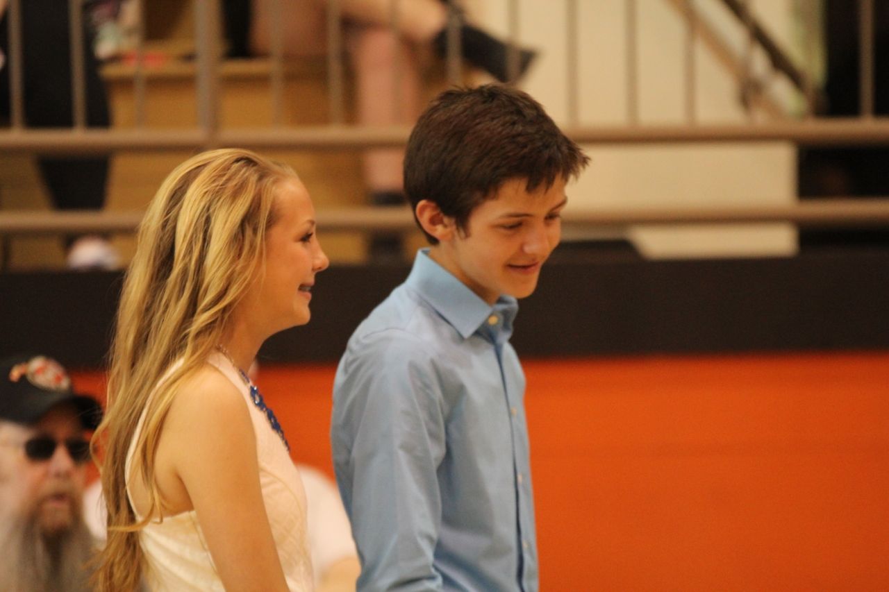 Rylee Sarti (left) and Jack Jarman (right) share a laugh while waiting to accept their certificate of promotion. 