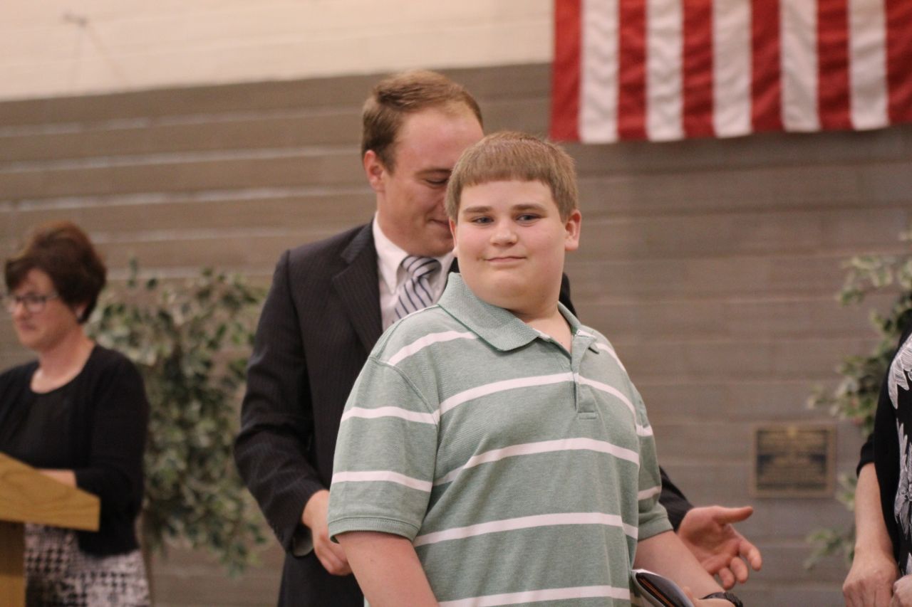 Riley Sandretto shows a smile after accepting his certificate. 