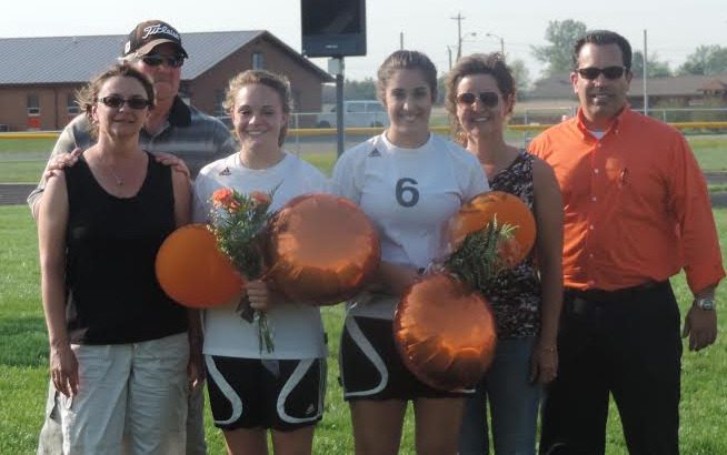 The Gillespie girls' soccer team recognized their two senior athletes last Wednesday. On the left, the family of Rachel Boeck and on the right, the family of Karli Libbra. (Contributed photo)