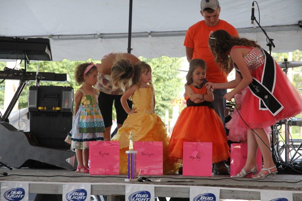 Junior Miss Madison Hedrick asking Karley Lyons a question on stage Saturday afternoon during the Little Miss and Mini Miner pageant. 