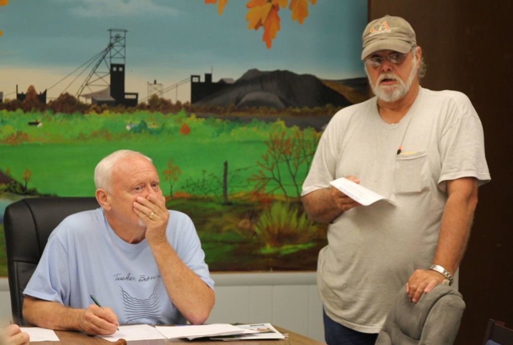 Donnie Shuey, right, discusses the unpleasant findings with the council. 