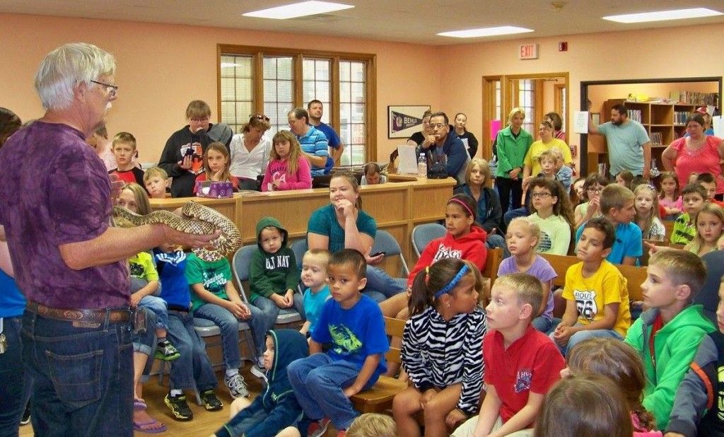 Benld Library was filled to capacity last week for Blackburn College's presentation about reptiles. Readers were able to hold a variety of the animals and get their picture taken with them. (Contributed photo/Benld Library)