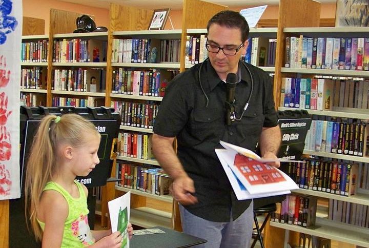 Summer fun continued at the local libraries last week. The Benld Library had Chris Carpunky perform a magic show and everyone loved his performance. (Photo by Benld Public Library)