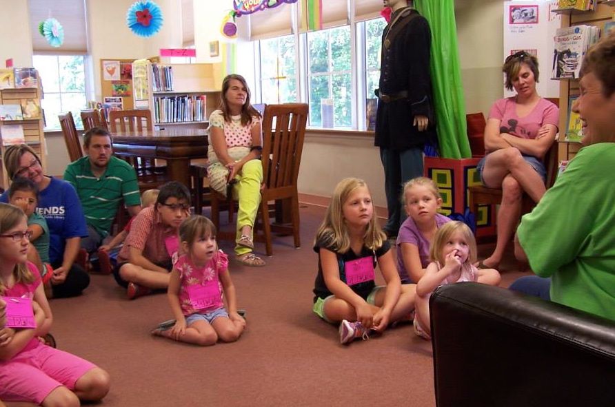 Miss Debbie reads a story to the group of kids that were attending Gillespie Library's storytime last week. (Photo by Gillespie Public Library)