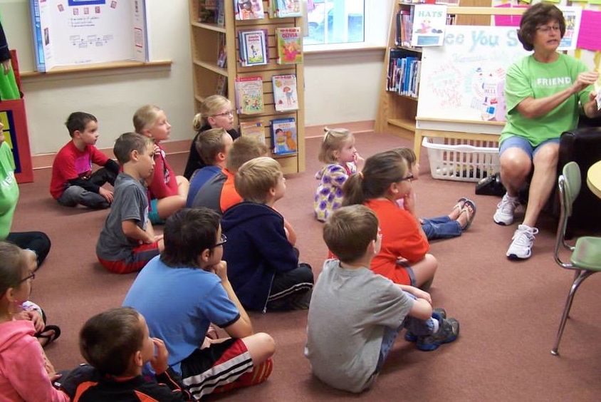 Mrs. Frizzo reads a story during Gillespie Library's "All about sound and telephones" program last week. 