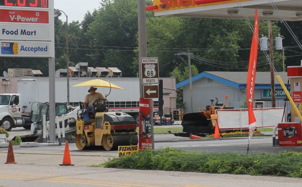 Delaurent Construction paves parts of the lot at Shell gas station with asphalt last Thursday. 