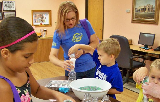 Youngsters that participated in Benld Library's reading program last week made seek and find bottles. (Photo by Benld Public Library) 