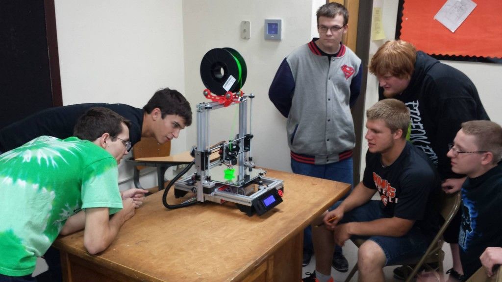 Students at Gillespie High School watch in awe as they work with a 3D printer for the first time last week. (Photo by Gillespie Unit School District)