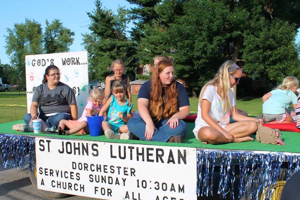 St. John's Lutheran Church of Dorchester loads their float with youth from the church for the annual Dorchester Homecoming Parade held last Saturday evening. (Photo by the Village of Dorchester)