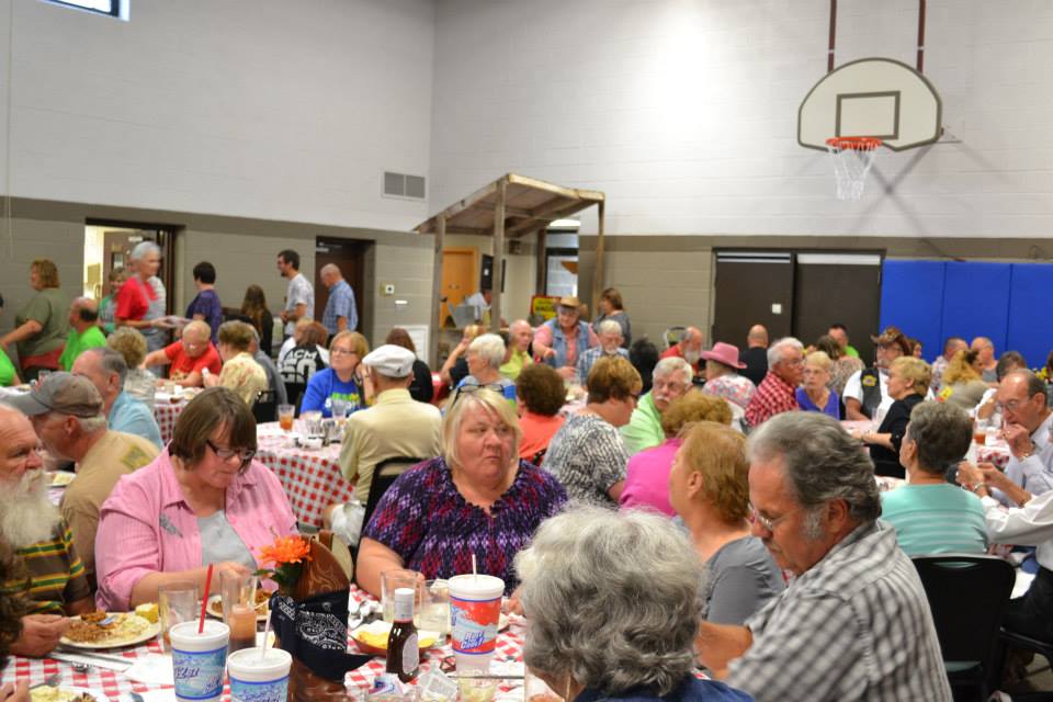 The United Methodist Church of Gillespie's gym was filled to capacity as hundreds of people supported the mission work team by attending the 4th annual hog roast.  (Photo by the UMC Missions Work Team)