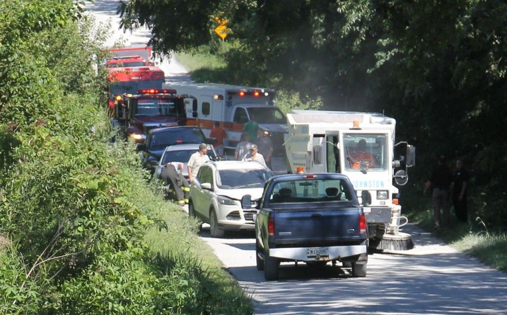 First responders assess the accident scene on Lake Road Tuesday afternoon after a vehicle hit the city's street sweeper. Read more about the accident here. 