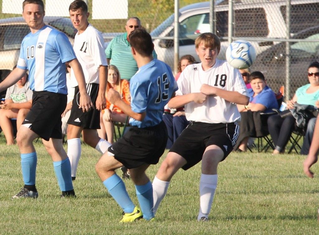 Michael Ross holds his hands in tight as he waits for the ball to fall so he can put a foot on it. 