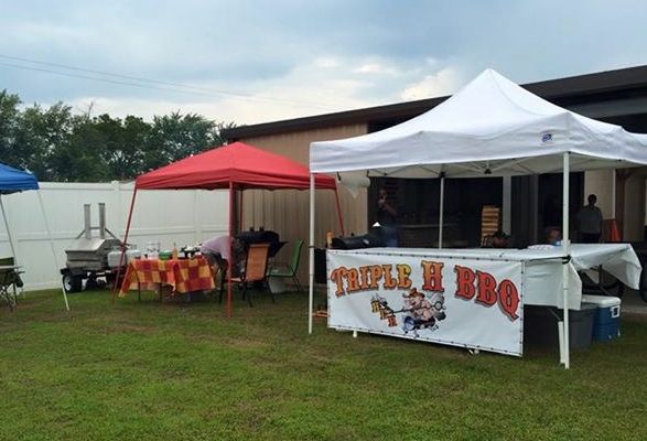 Tents line the open lot next to the Progressive Club in Wilsonville yesterday for the bar's annual rib cook off event. (Photo by Bob Carr)