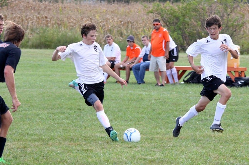 Ronnie Bertolino (left) and Jack Jarman (right) team up on a chance to score for Gillespie in the high school soccer team's game versus Hillsboro last week. The Miners lost the battle. 