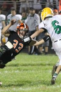 Jordan Redmon (#33) dives for his opponent during a punt return.