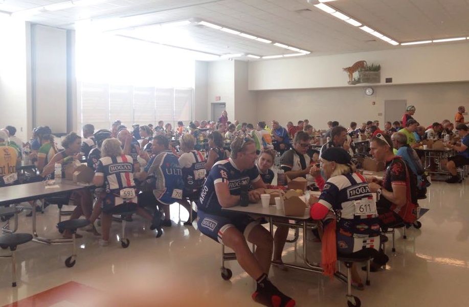 Nearly every table and seat is filled inside the Ben-Gil Elementary School's Commons Area as participants in the Bike for MS socialize while taking a quick rest. 