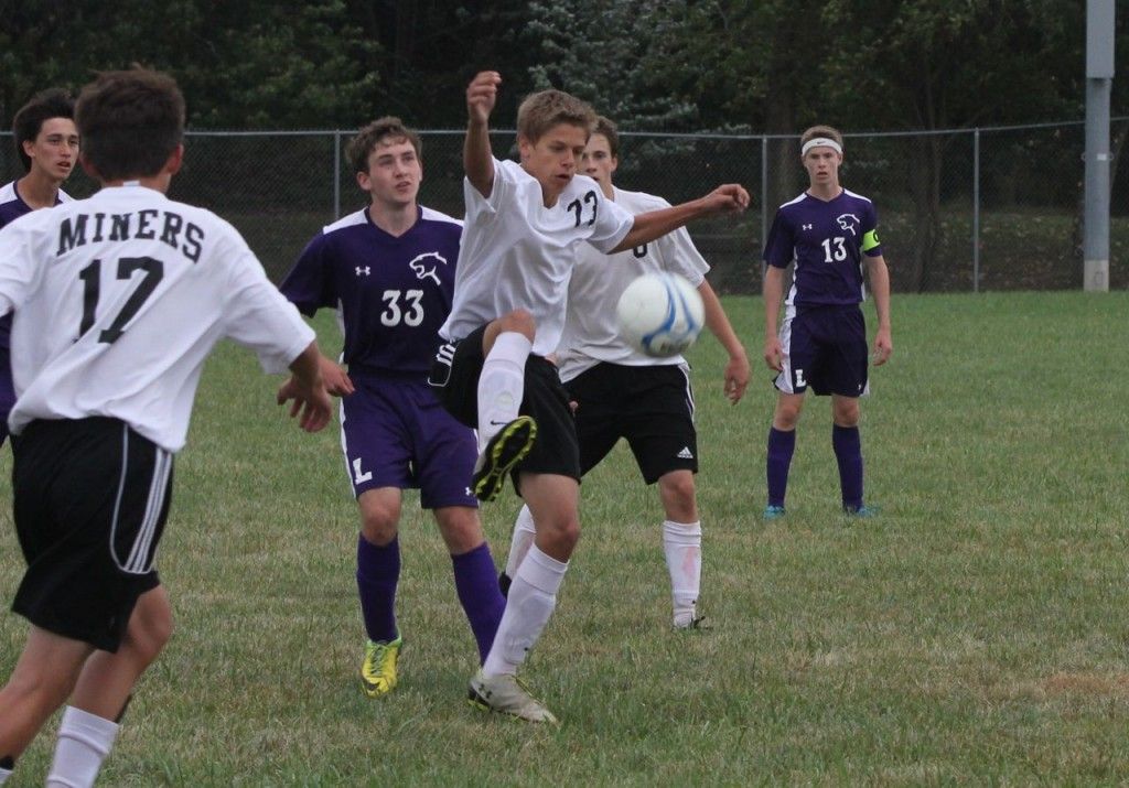 Austin Cooper settles the goalie's kick. 