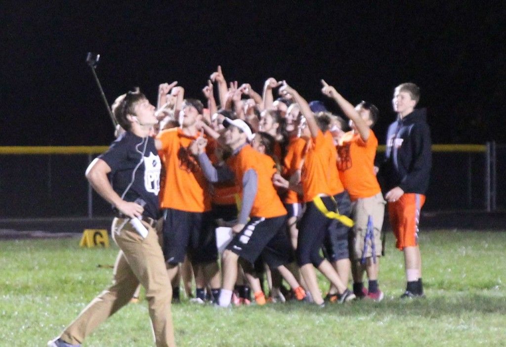 The junior class takes a selfie for an extra point conversion Wednesday evening during the annual homecoming powder puff football game. 