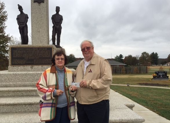 Photo Caption: On a visit to the Union Miners Cemetery this week, Marilyn Rhodes of Gillespie, presented a check for $1000.00 to Union Miners Perpetual Care Association president Ed Becker. The donation will help provide continued improvements to the cemetery and monument.