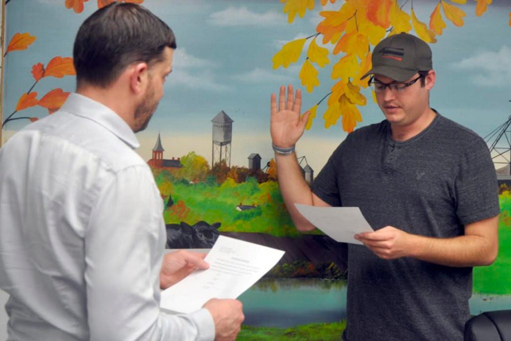 City Attorney Kevin Polo (left) swearing appointed Colin Mussatto to finish Ottersburg’s term.