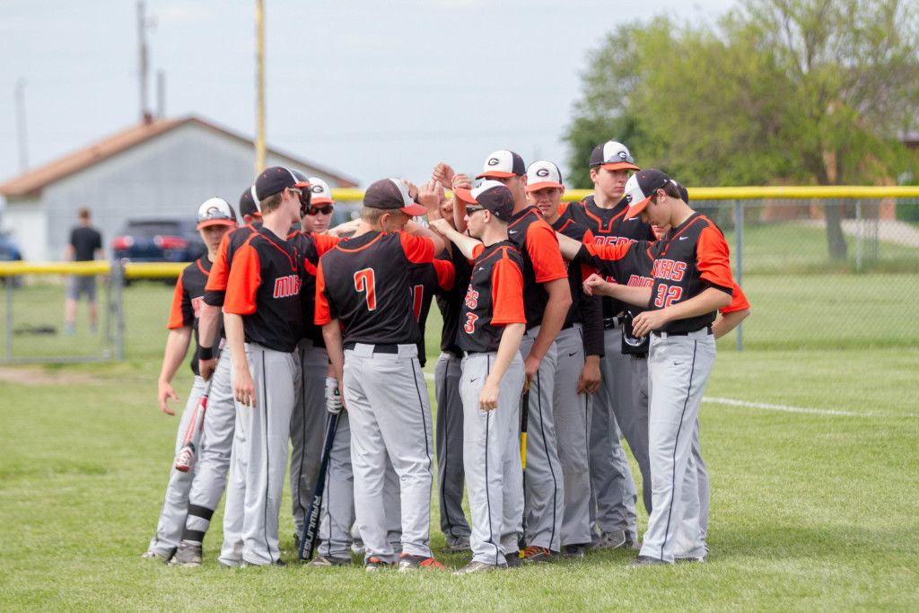 The baseball team brings it together before the game starts last Thursday.