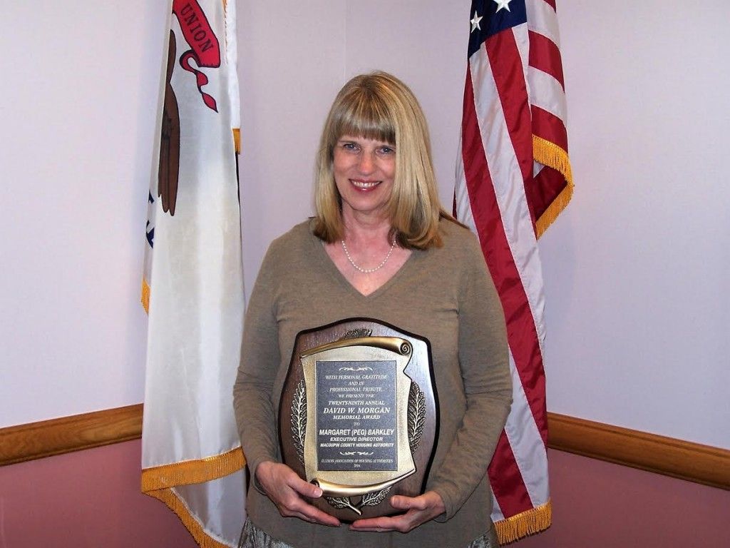 Margaret (Peg) Barkley, CEO of Macoupin County Housing Authority in Carlinville, with the David W. Morgan Memorial Award.
