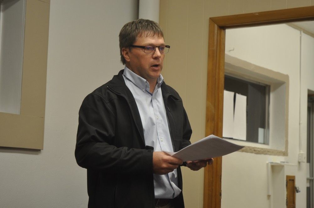 Doug Ratermann of Henry, Meisenheimer and Gende Engineers, presents the annual motor fuel tax resolution to the Benld council.